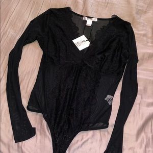 Black sheer body suit with lace detailing